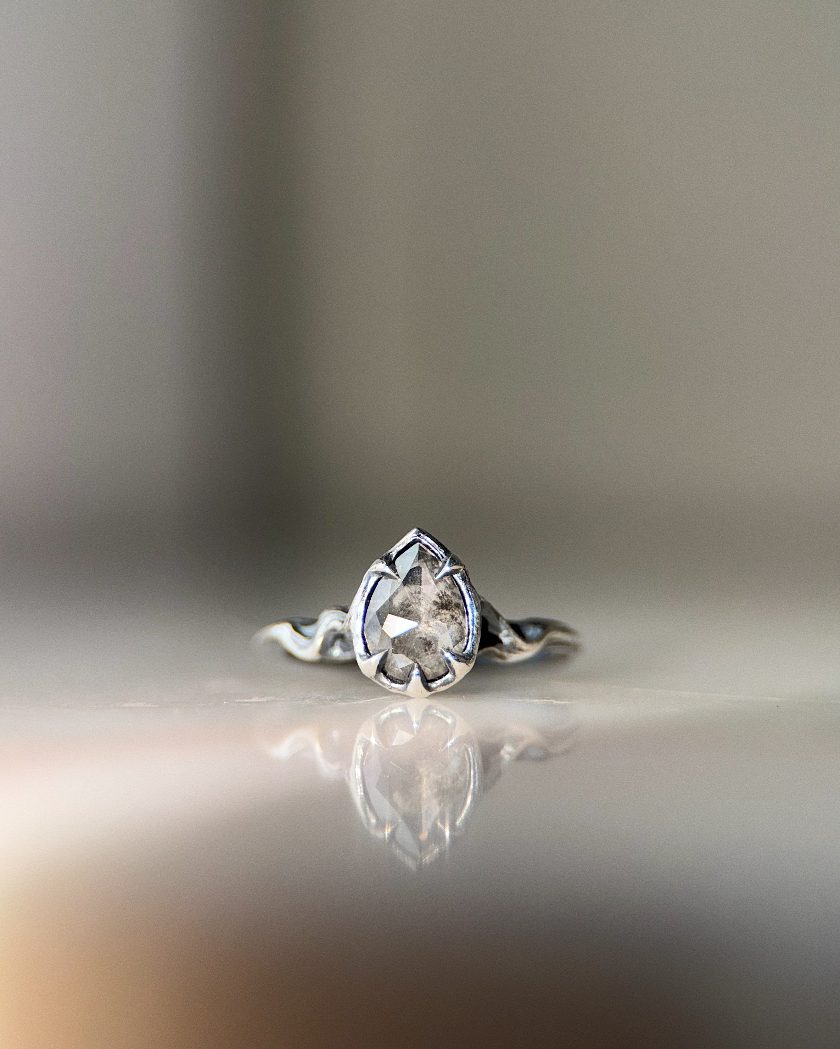 ecclesia pyre ring in sterling silver set with  pear shaped 6 x 8 mm lab grown salt and pepper diamond